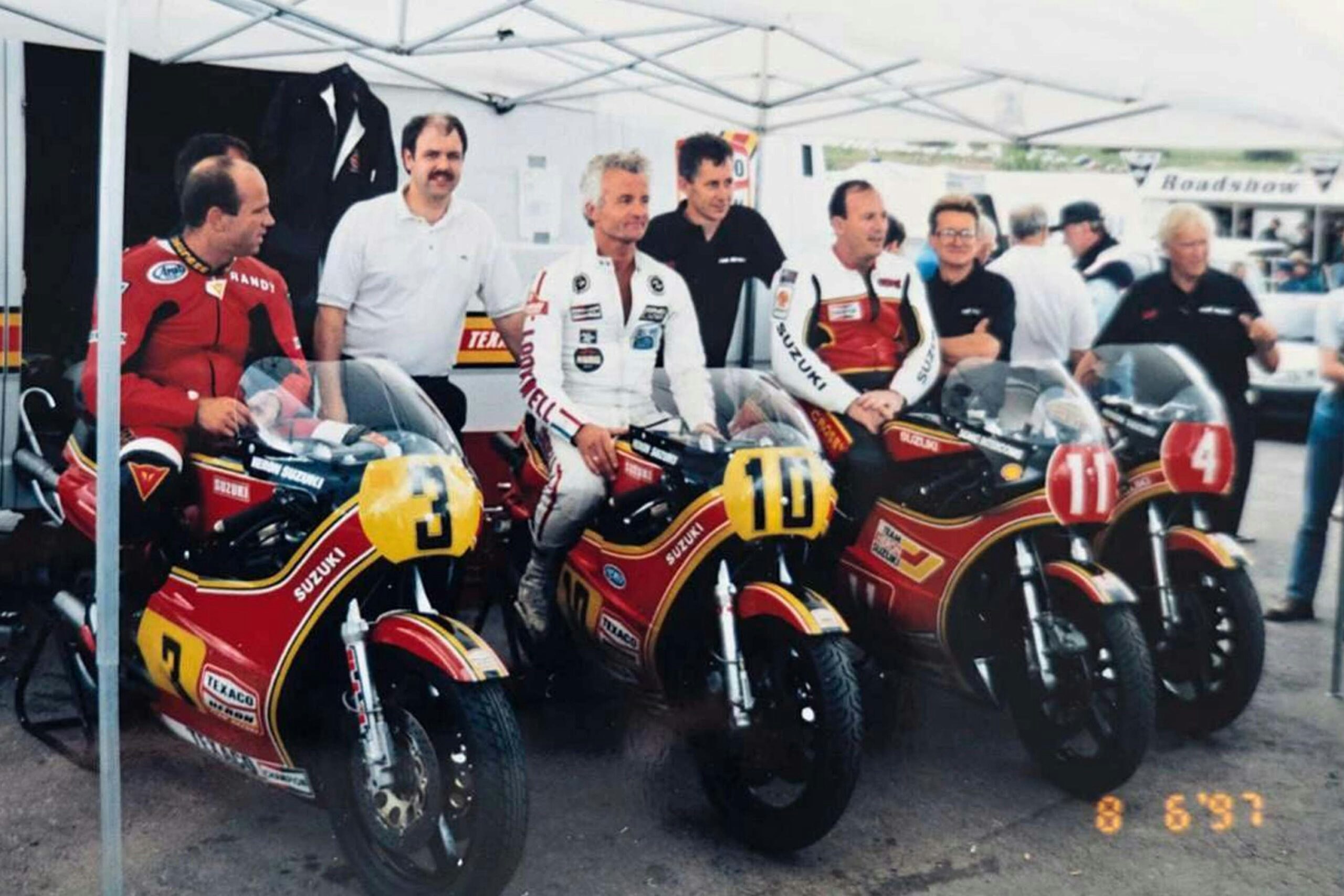 By 1997, Paul was occasionally helping to prepare old Suzukis for parades, like this one at Mallory. Left to right: Randy Mamola, Paul, Wil Hartog, Steve Moore, Graeme Crosby and Rex White