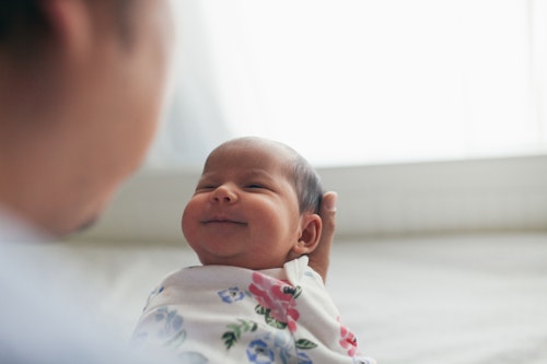 New born baby smiling